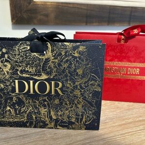 SET OF 2 CHRISTIAN DIOR MINI GIFT BAGS WITH DIOR TISSUE AND RIBBON CLOSURE.